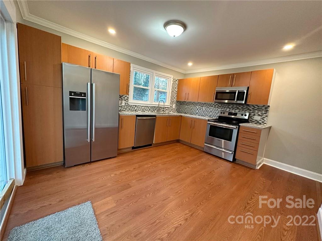 506 East Frederick Street Gaffney, SC 29340 - Photo 15 of 25 a kitchen with stainless steel appliances granite countertop a refrigerator stove top oven and sink
