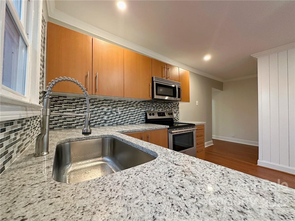 506 East Frederick Street Gaffney, SC 29340 - Photo 16 of 25 a kitchen that has a sink and a stove top oven