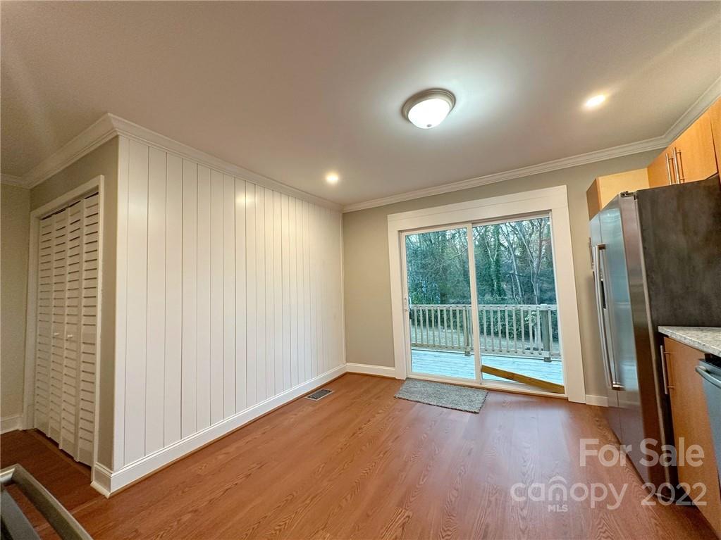 506 East Frederick Street Gaffney, SC 29340 - Photo 17 of 25 an empty room with wooden floor and windows