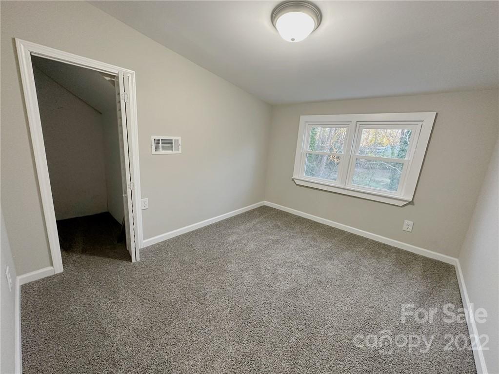 506 East Frederick Street Gaffney, SC 29340 - Photo 21 of 25 an empty room with windows and closet