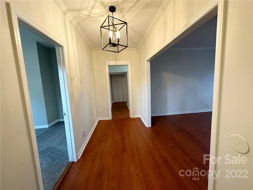 506 East Frederick Street Gaffney, SC 29340 - Photo 4 of 25 a view of a hallway with wooden floor and staircase