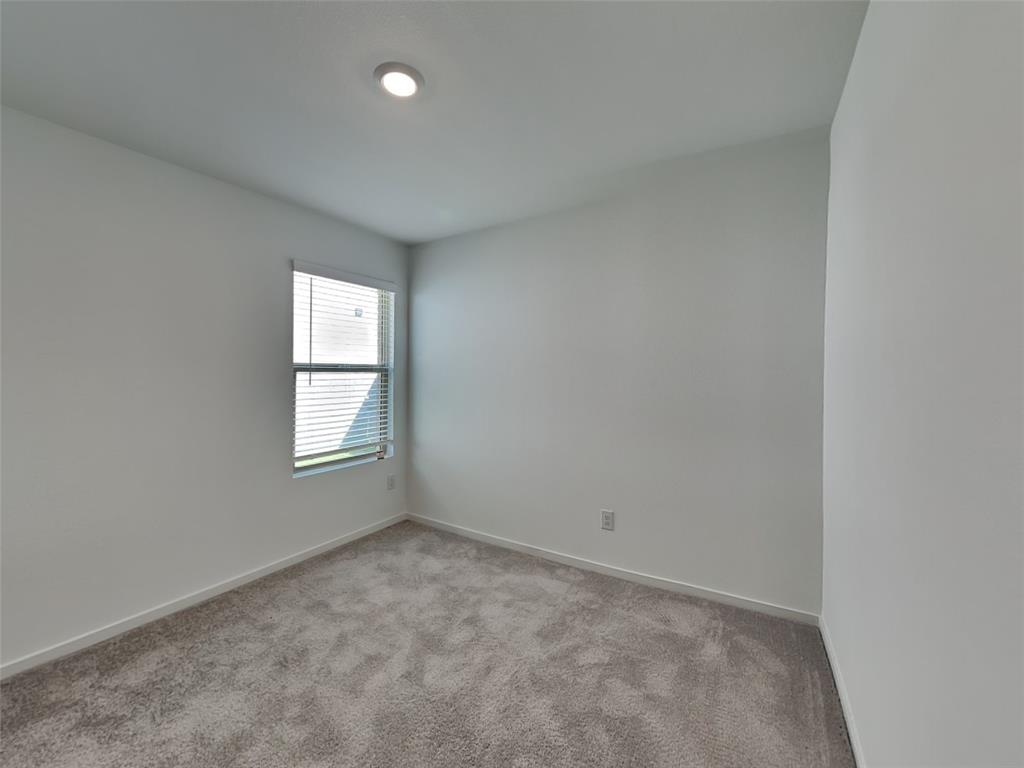 4229 Brindley Road Little Elm, TX 75068 - Photo 11 of 15 an empty room with a window