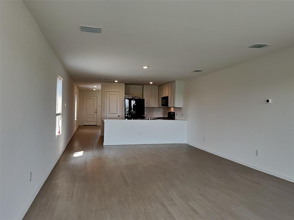 4229 Brindley Road Little Elm, TX 75068 - Photo 4 of 15 a view of a kitchen with a sink and cabinets