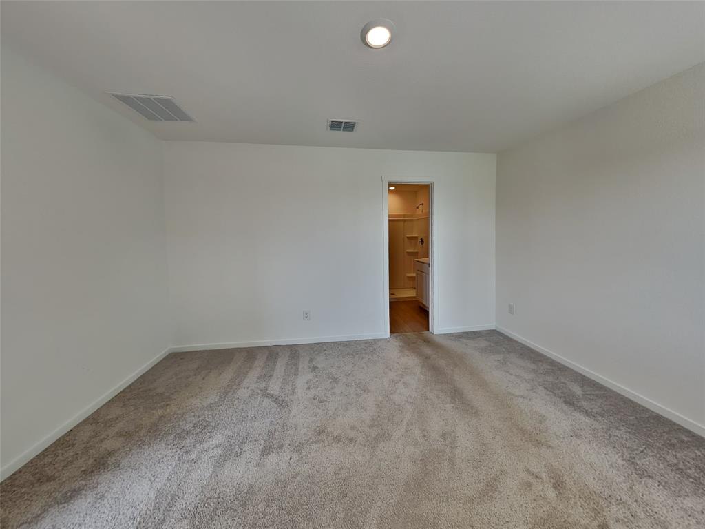 4229 Brindley Road Little Elm, TX 75068 - Photo 6 of 15 an empty room with an entryway