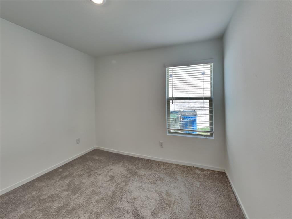 4229 Brindley Road Little Elm, TX 75068 - Photo 9 of 15 an empty room with a window