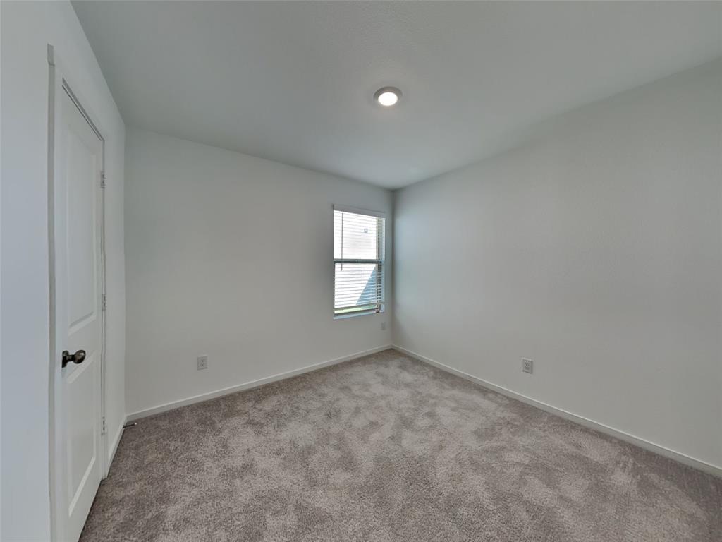 4229 Brindley Road Little Elm, TX 75068 - Photo 10 of 15 a view of an empty room with a window