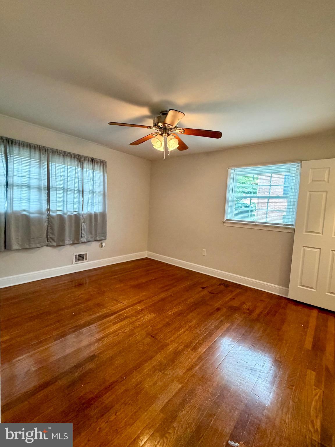 1010 Nottingham Street Culpeper, VA 22701 - Photo 9 of 21 an empty room with wooden floor and windows