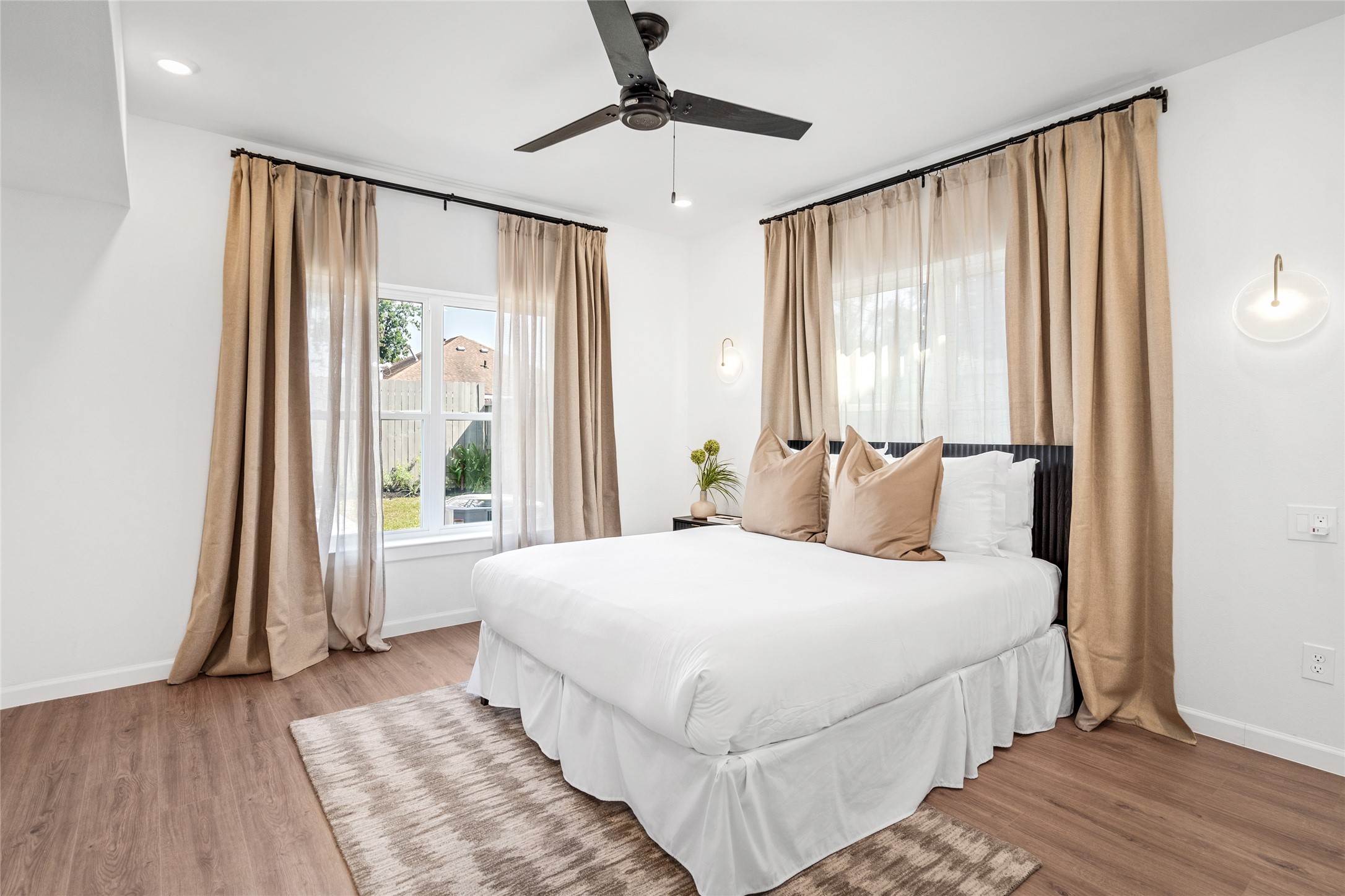 2901 Cleburne Street Houston, TX 77004 - Photo 24 of 50 a bedroom with a large bed and a chandelier