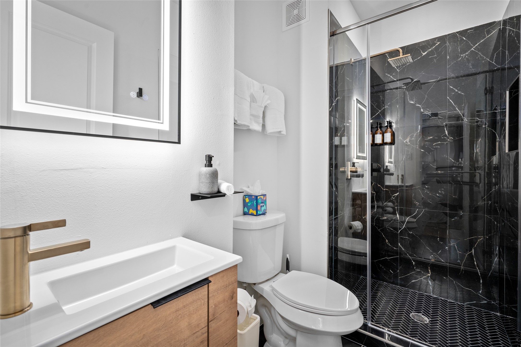 2901 Cleburne Street Houston, TX 77004 - Photo 27 of 50 a bathroom with a sink a toilet a shower and a mirror