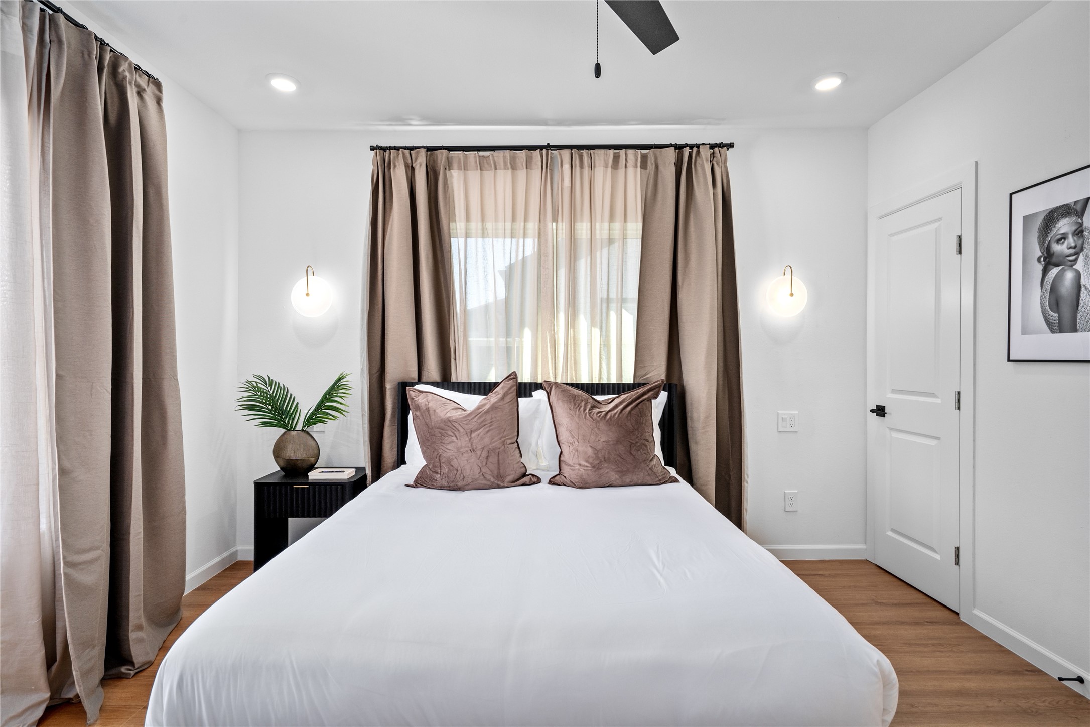 2901 Cleburne Street Houston, TX 77004 - Photo 41 of 50 a large bed sitting in a bedroom next to a window
