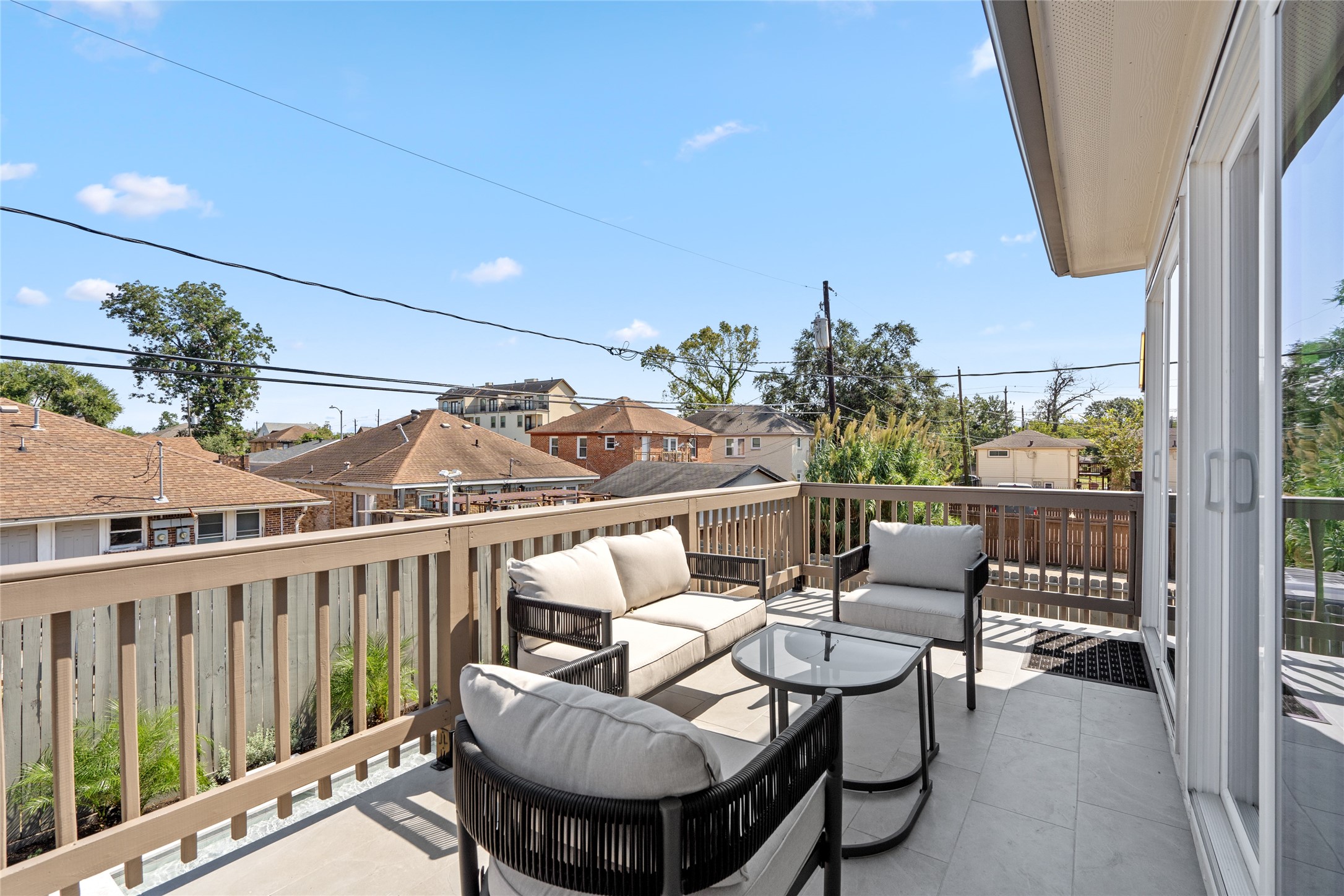 2901 Cleburne Street Houston, TX 77004 - Photo 46 of 50 a balcony with wooden floor and outdoor seating