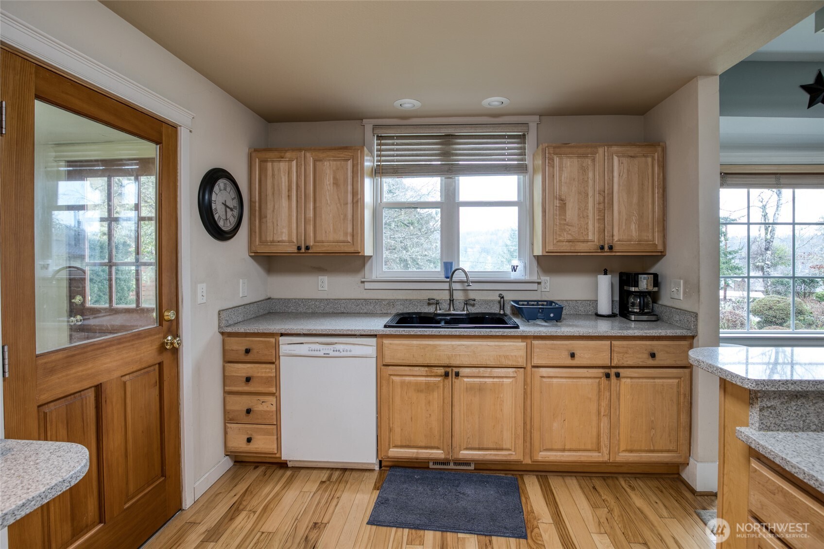 722 7th Avenue Aberdeen, WA 98520 - Photo 15 of 38 a kitchen with stainless steel appliances granite countertop wooden floors and sink