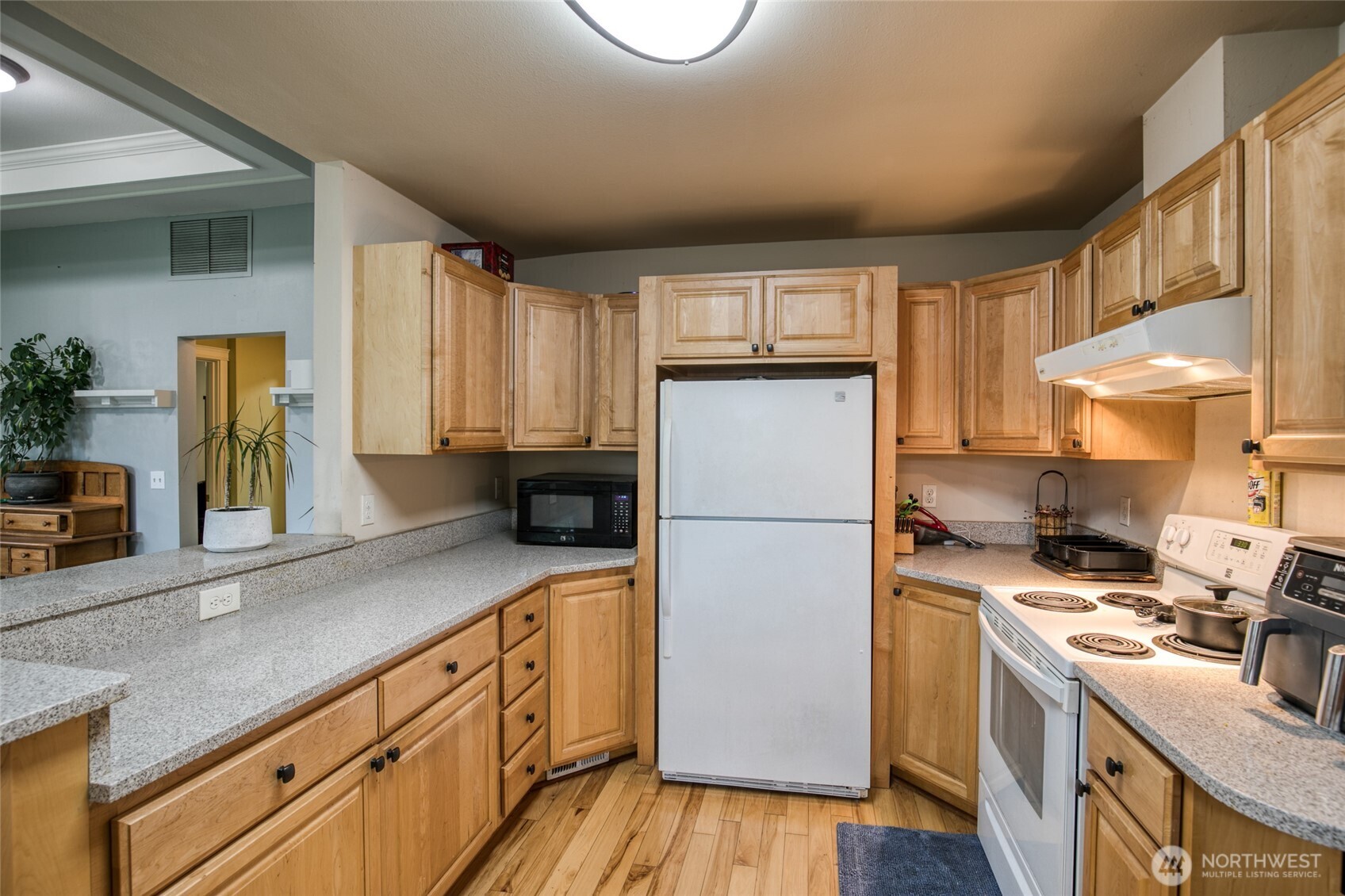 722 7th Avenue Aberdeen, WA 98520 - Photo 16 of 38 a kitchen with kitchen island granite countertop a sink a counter space and cabinets