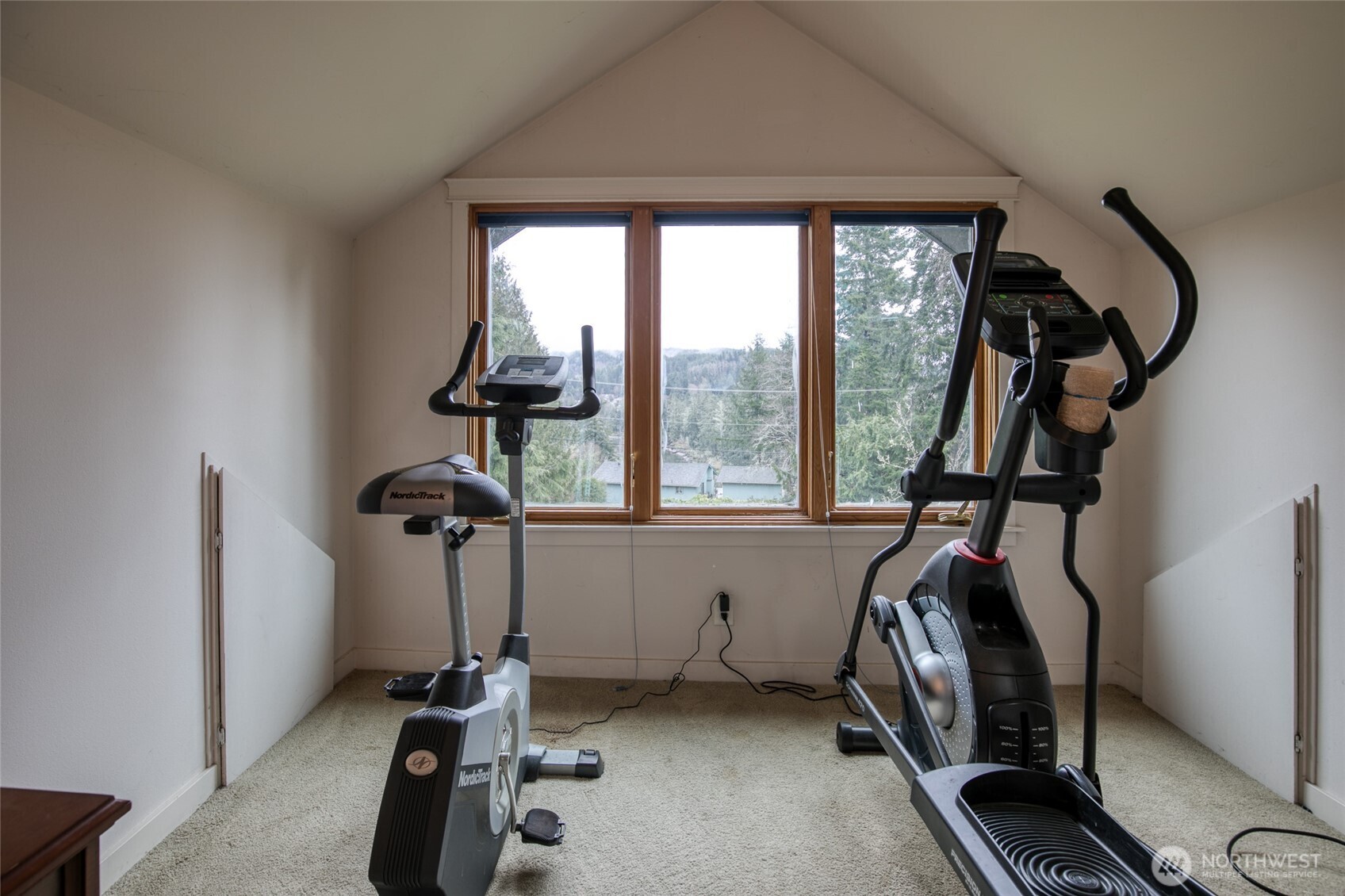 722 7th Avenue Aberdeen, WA 98520 - Photo 28 of 38 a room with gym equipment and a large window