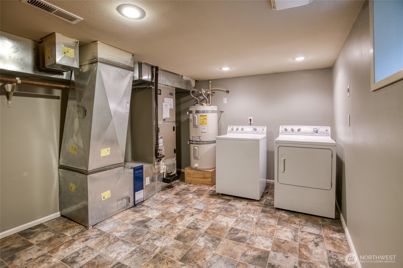 722 7th Avenue Aberdeen, WA 98520 - Photo 33 of 38 a view of a storage & utility room with washer and dryer