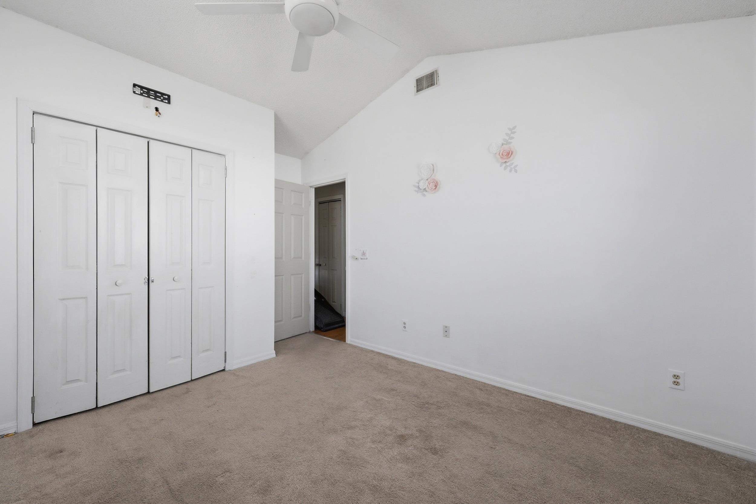 5296 Timucua Circle St. Augustine, FL 32086 - Photo 20 of 65 Unfurnished bedroom with carpet, a ceiling fan, and a closet