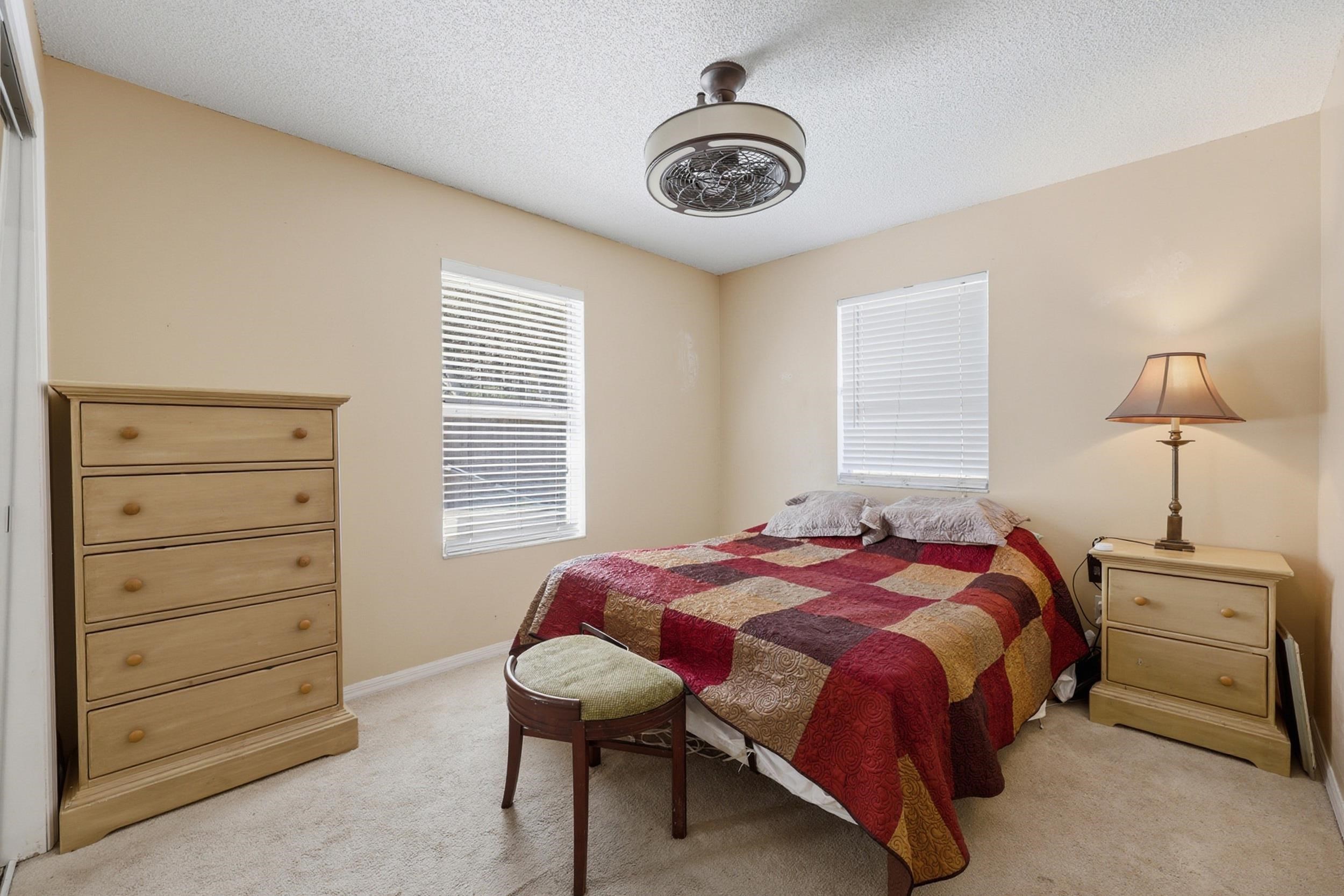 5296 Timucua Circle St. Augustine, FL 32086 - Photo 22 of 65 Bedroom with a textured ceiling and light colored carpet