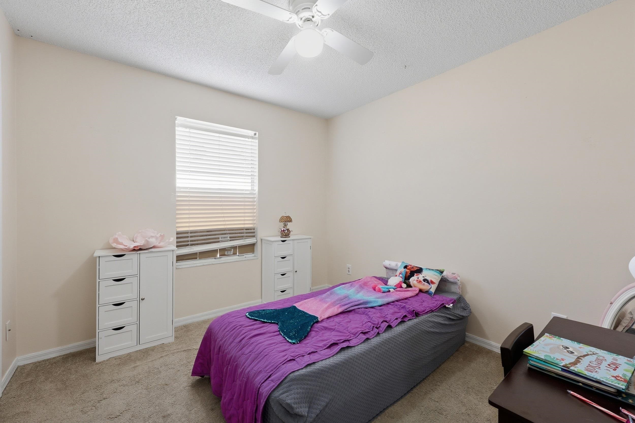5296 Timucua Circle St. Augustine, FL 32086 - Photo 24 of 65 Carpeted bedroom with a textured ceiling and a ceiling fan