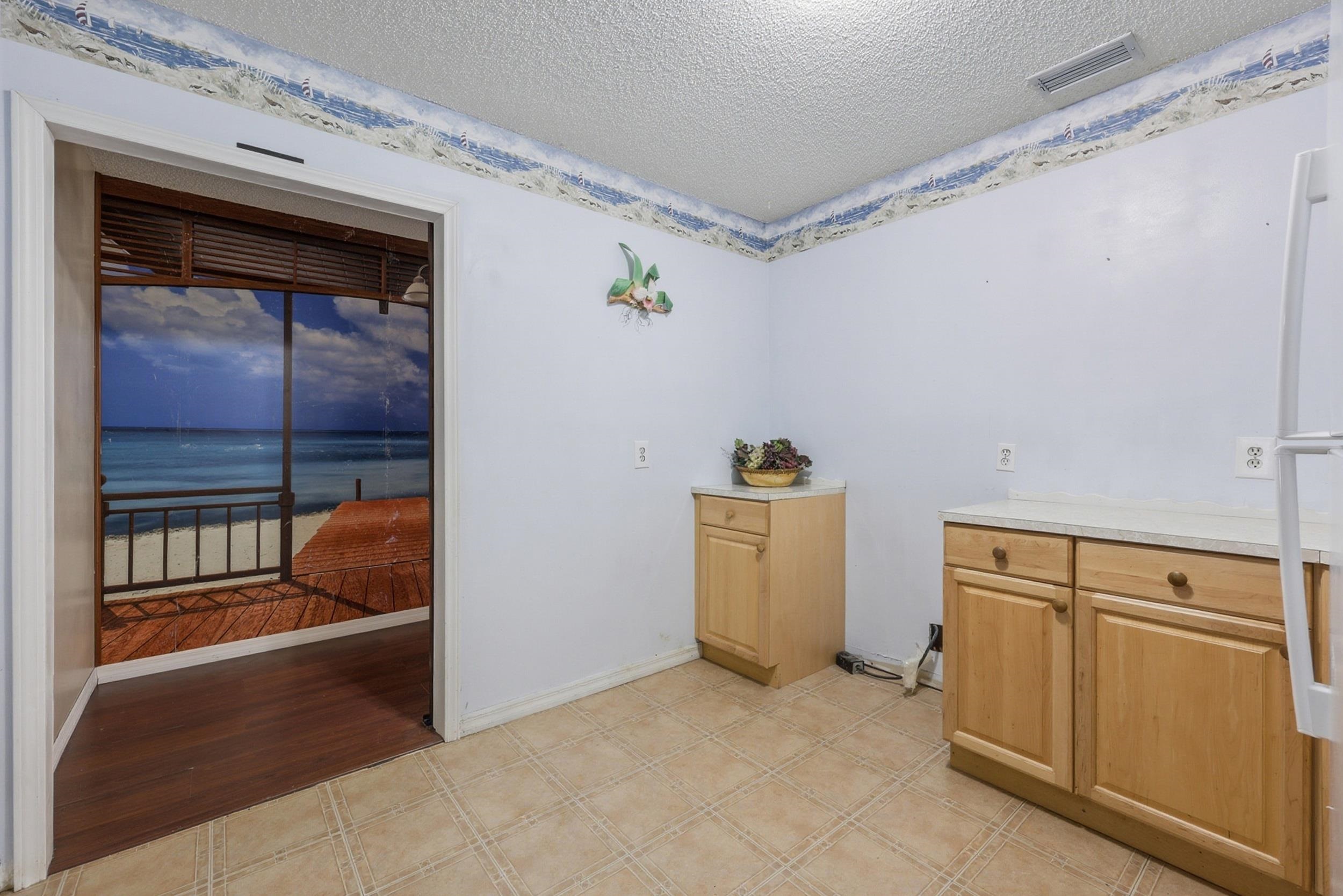 5296 Timucua Circle St. Augustine, FL 32086 - Photo 27 of 65 Laundry room featuring a textured ceiling and a water view