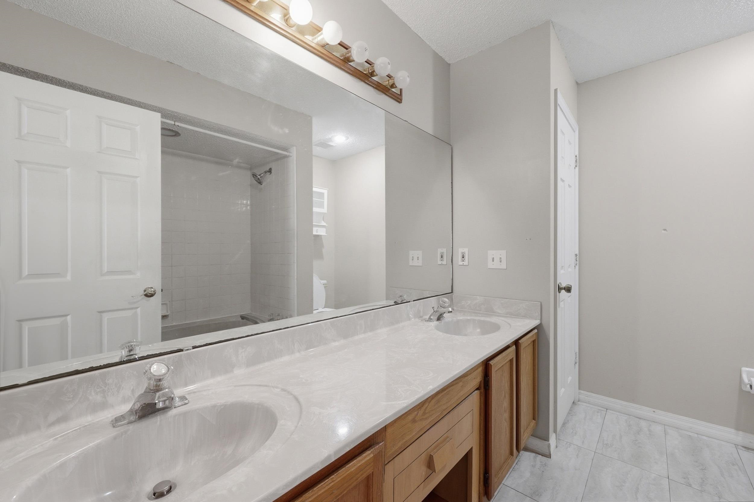 5296 Timucua Circle St. Augustine, FL 32086 - Photo 30 of 65 Full bathroom featuring double vanity and shower / washtub combination