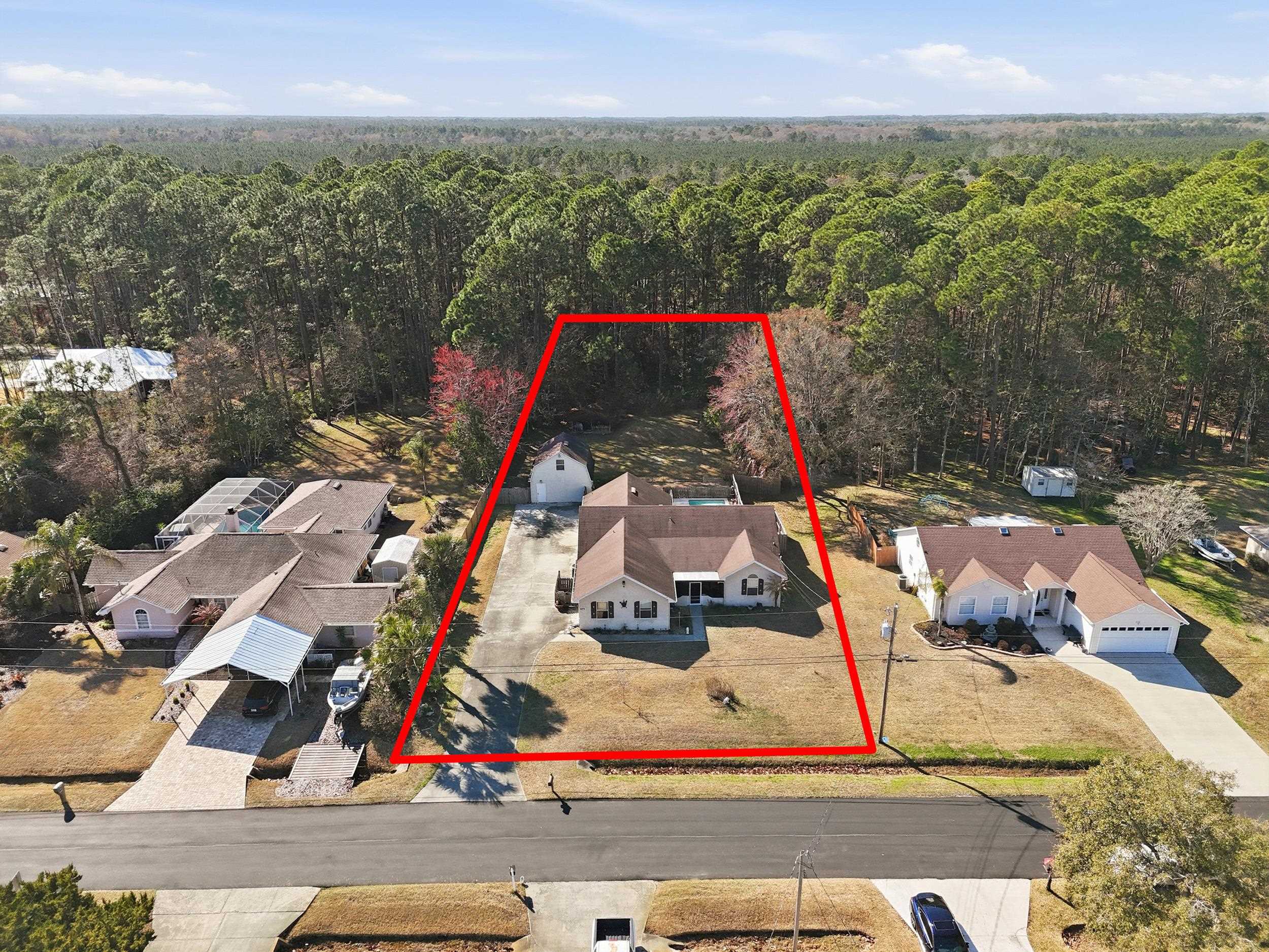 5296 Timucua Circle St. Augustine, FL 32086 - Photo 3 of 65 Aerial view of residential area featuring a forest and property parcel outlined