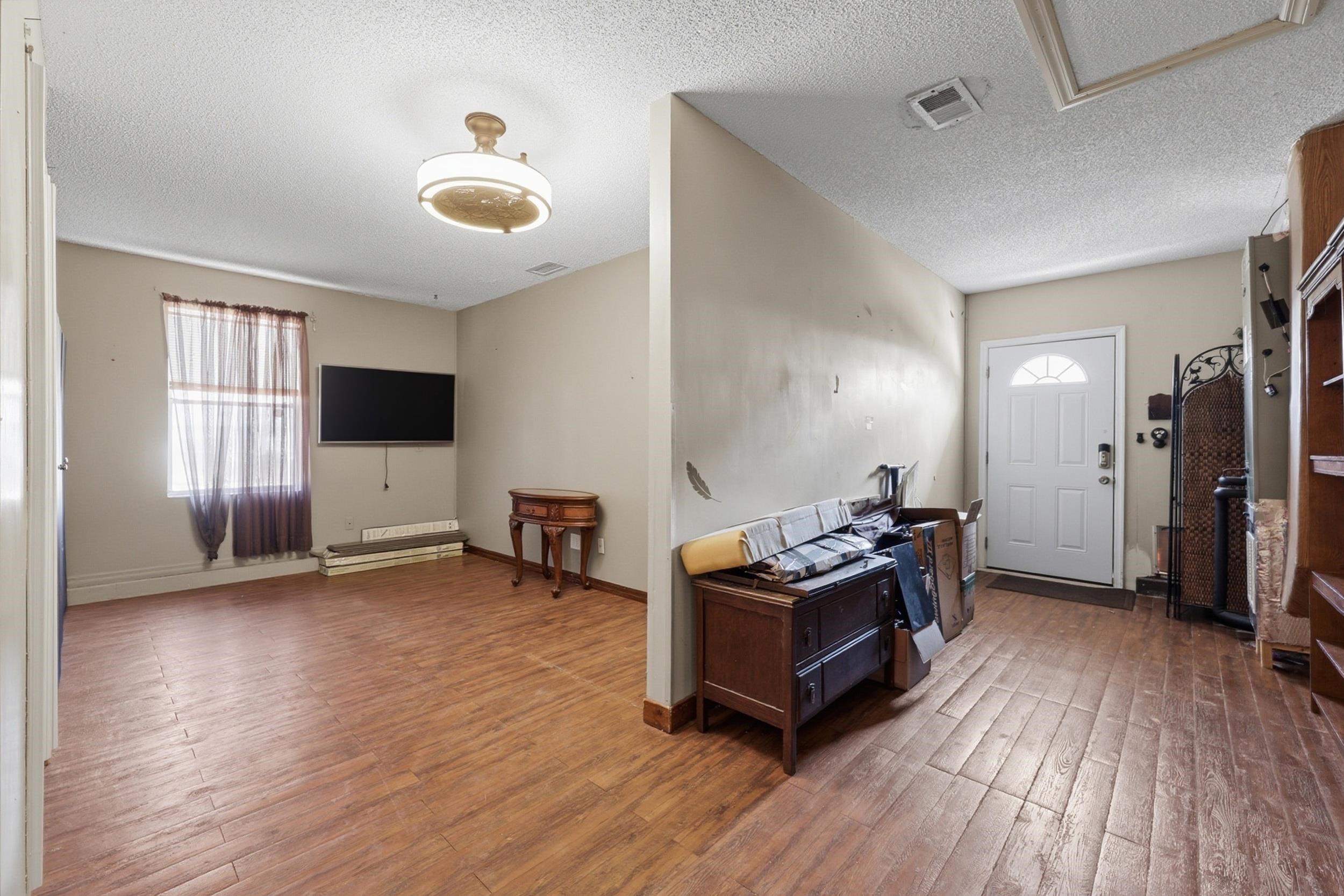 5296 Timucua Circle St. Augustine, FL 32086 - Photo 33 of 65 Entryway featuring a textured ceiling, hardwood / wood-style floors, and healthy amount of natural light