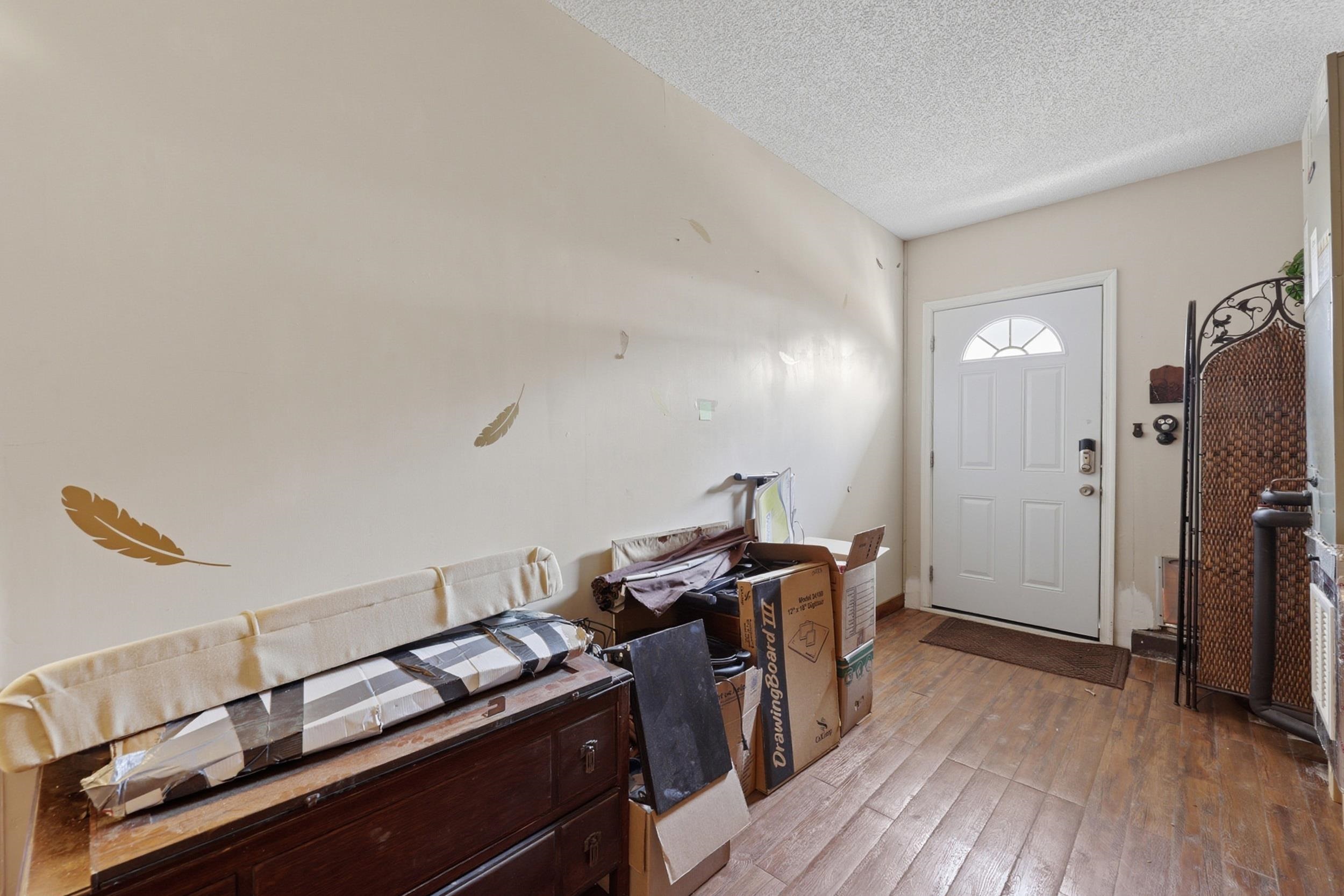 5296 Timucua Circle St. Augustine, FL 32086 - Photo 36 of 65 Entryway featuring light wood finished floors and a textured ceiling