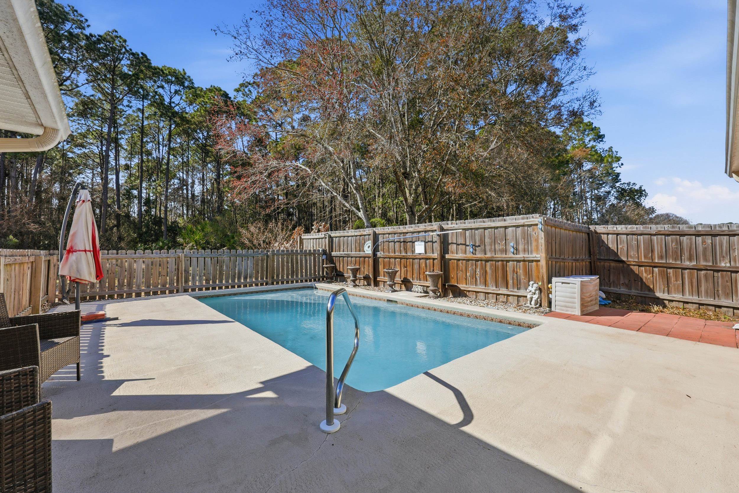 5296 Timucua Circle St. Augustine, FL 32086 - Photo 4 of 65 a view of a swimming pool with a patio