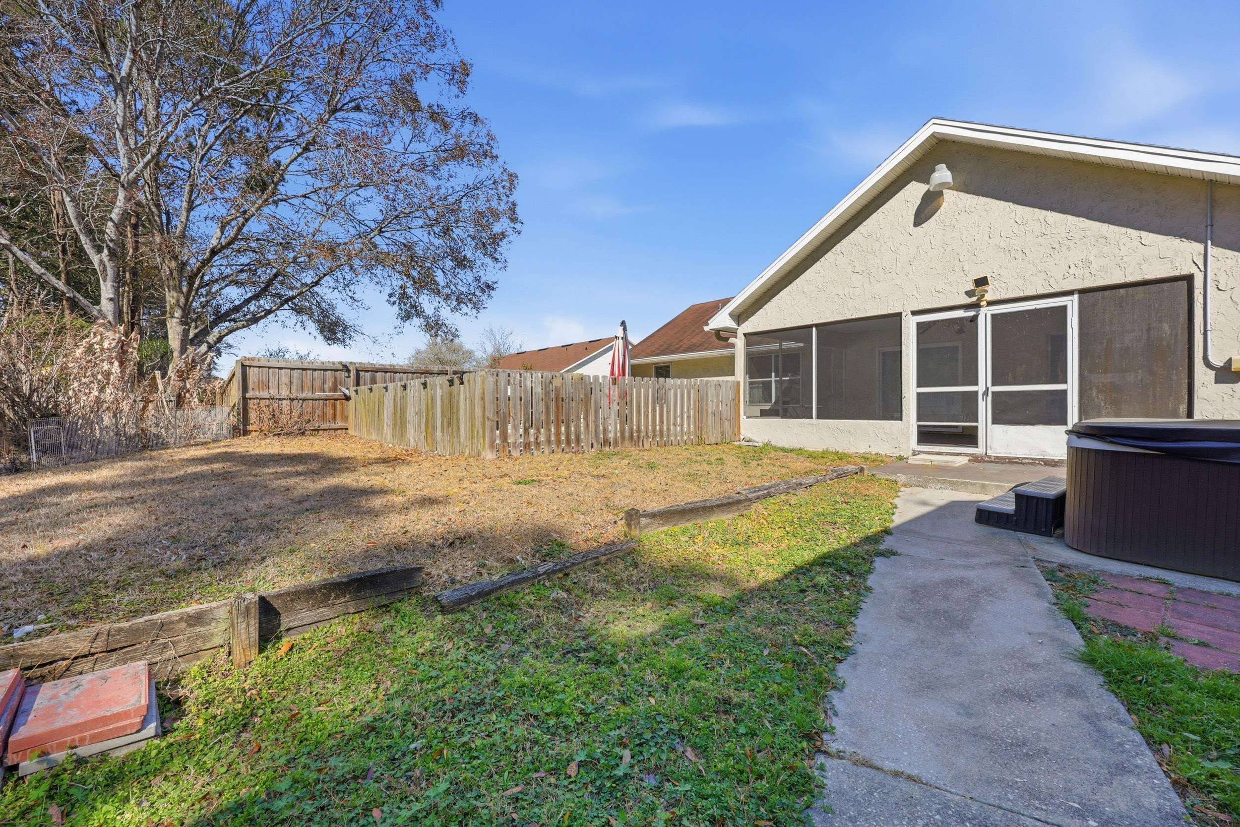 5296 Timucua Circle St. Augustine, FL 32086 - Photo 48 of 65 Fenced backyard with a sunroom