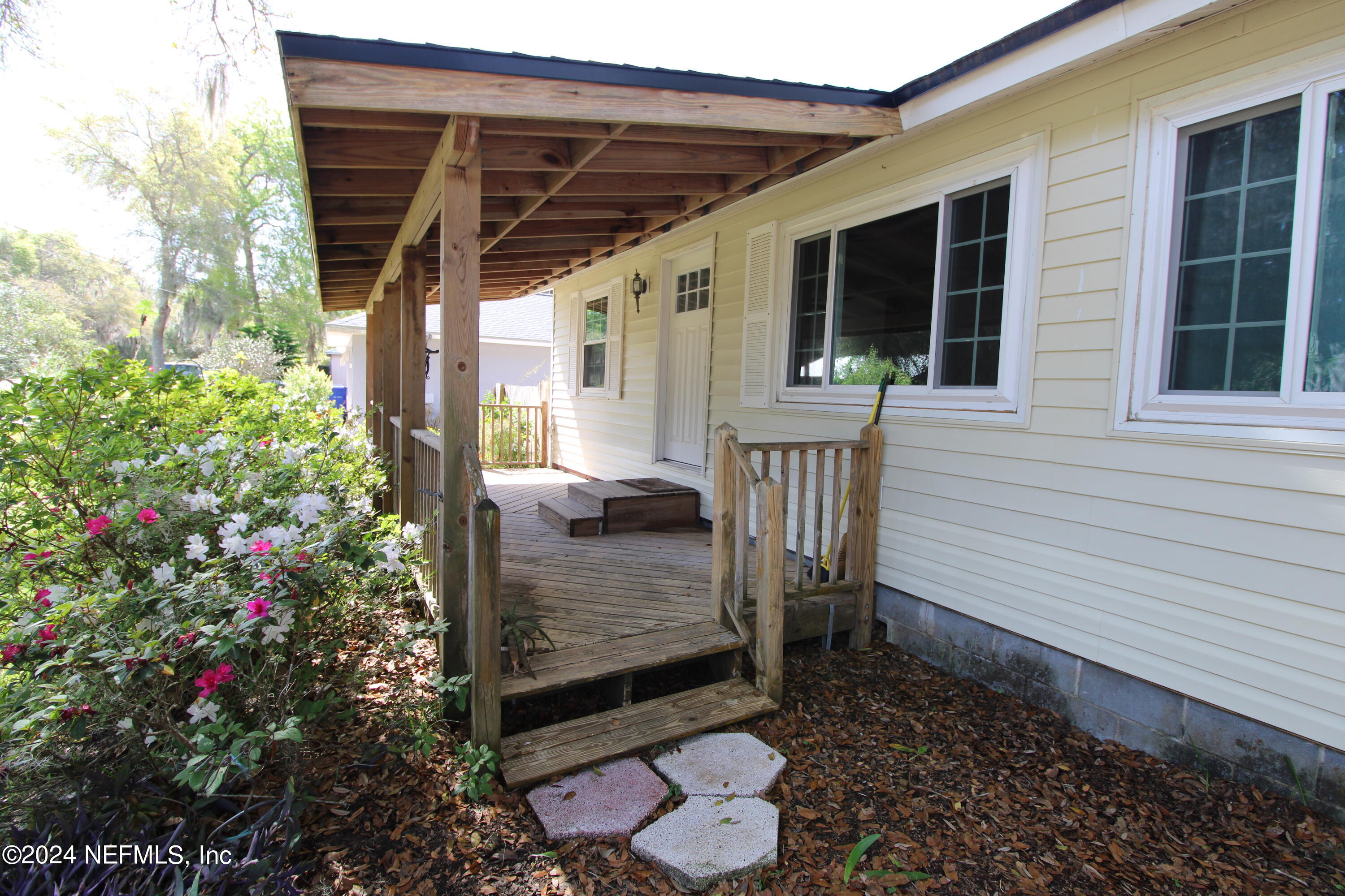1004 Queen Road St. Augustine, FL 32086 - Photo 3 of 49 a view of a porch with furniture