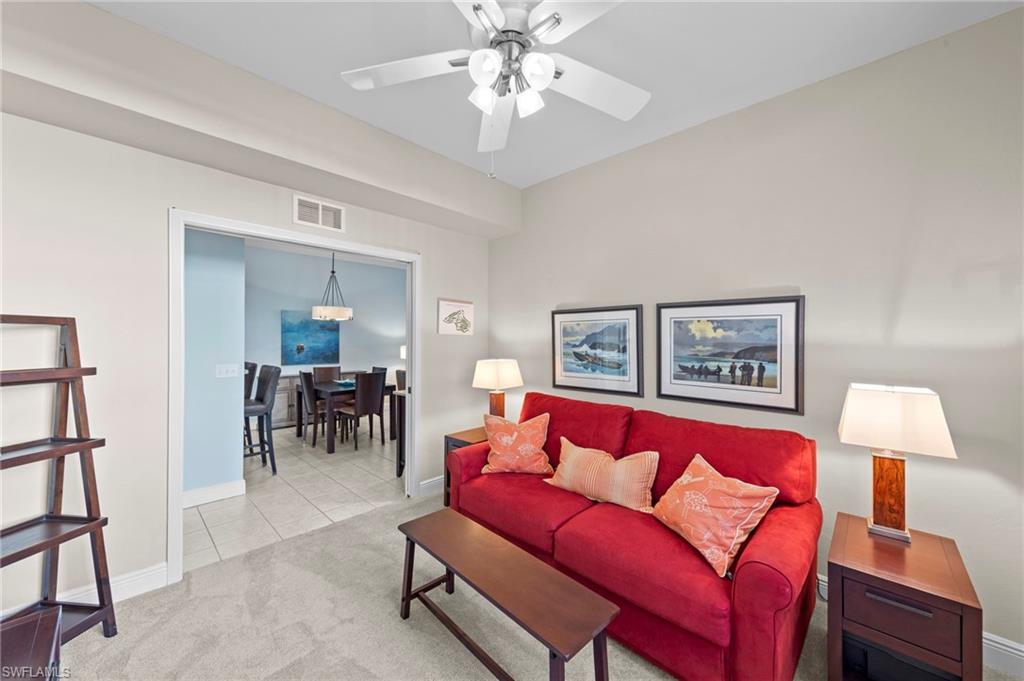 21330 Lancaster Run, Unit 1218 Estero, FL 33928 - Photo 18 of 49 a living room with furniture and a lamp