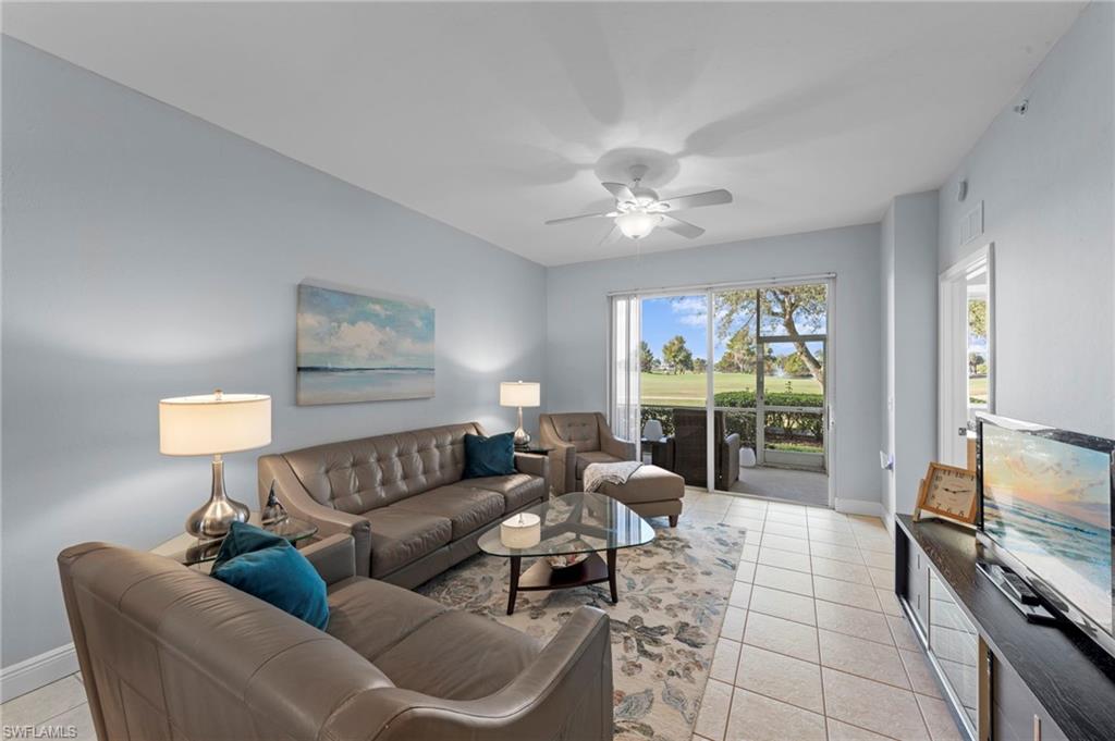 21330 Lancaster Run, Unit 1218 Estero, FL 33928 - Photo 5 of 49 a living room with furniture and a flat screen tv