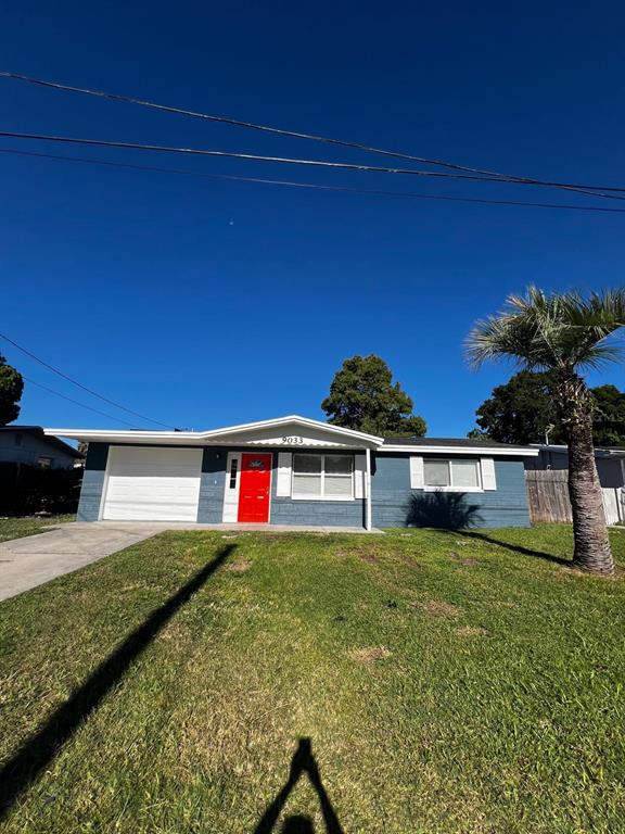 9033 Pegasus Avenue Port Richey, FL 34668 - Photo 12 of 18 a view of a house with a yard
