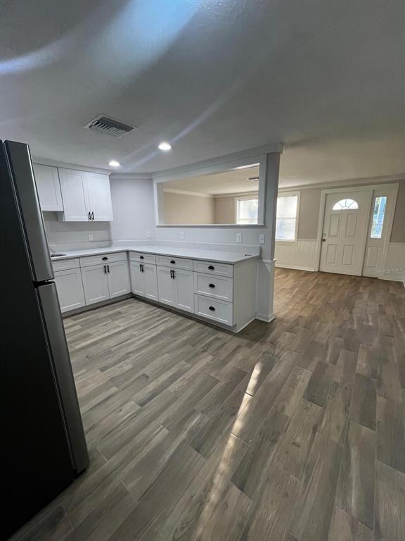 9033 Pegasus Avenue Port Richey, FL 34668 - Photo 16 of 18 a room with window and cabinet