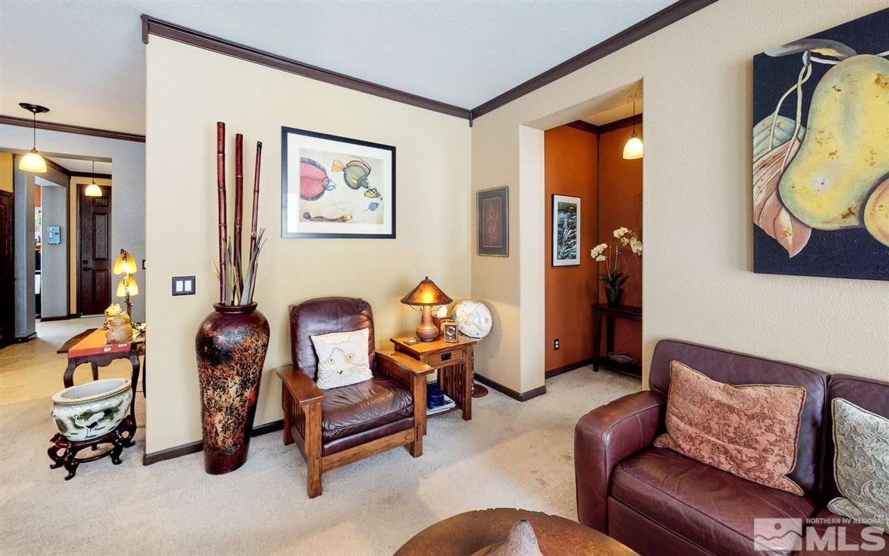 1270 Wakefield Trail Reno, NV 89523 - Photo 8 of 19 a living room with furniture and a gym machine