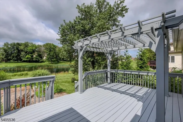 a view of a wooden deck with a lake view