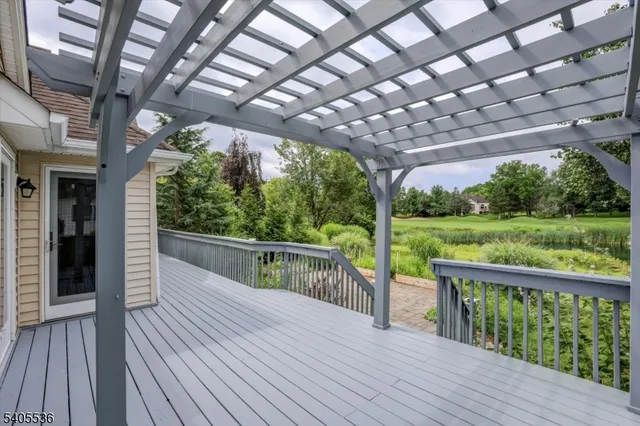 a view of outdoor space with deck and hardwood