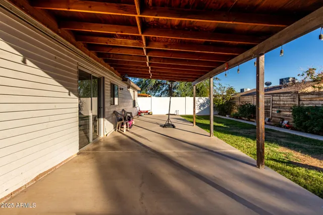 a view of a porch with furniture and roof