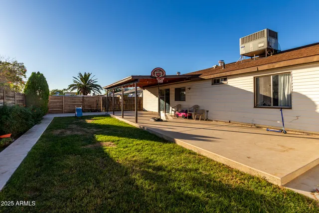 a view of a swimming pool with a patio