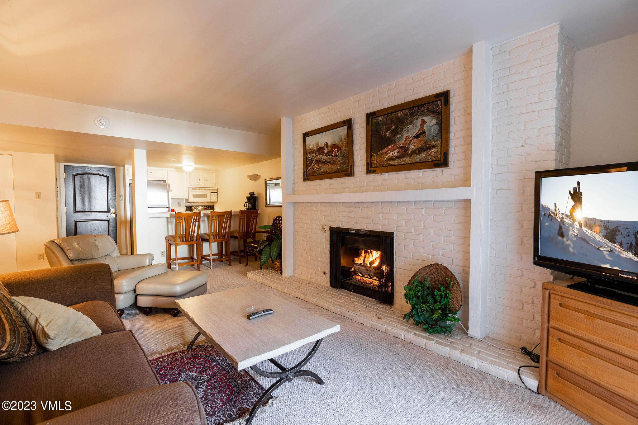 9 Vail Road, Unit 2D Vail, CO 81657 - Photo 3 of 11 a living room with furniture and a fireplace