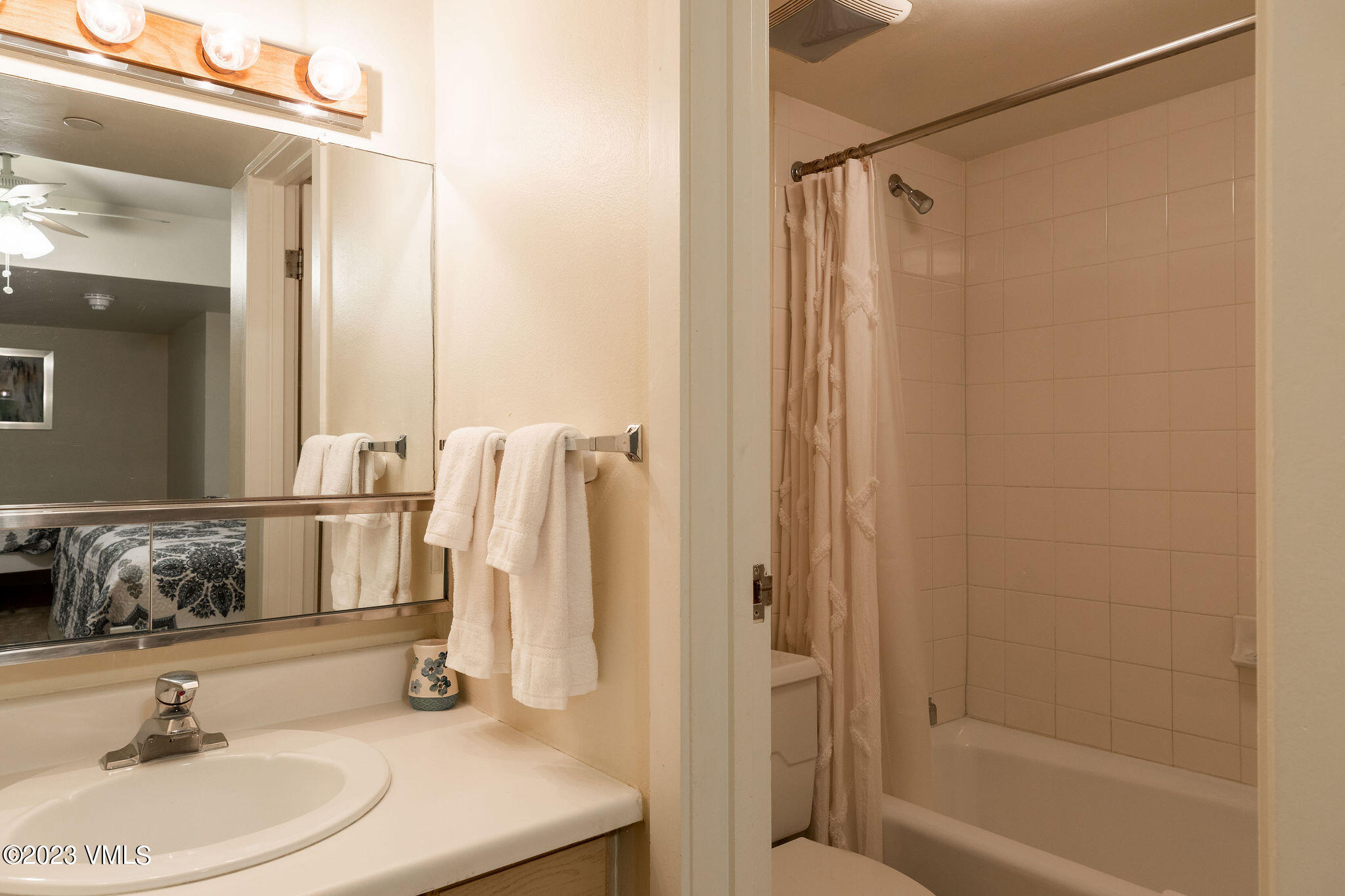 9 Vail Road, Unit 2D Vail, CO 81657 - Photo 9 of 11 a bathroom with a sink and a mirror