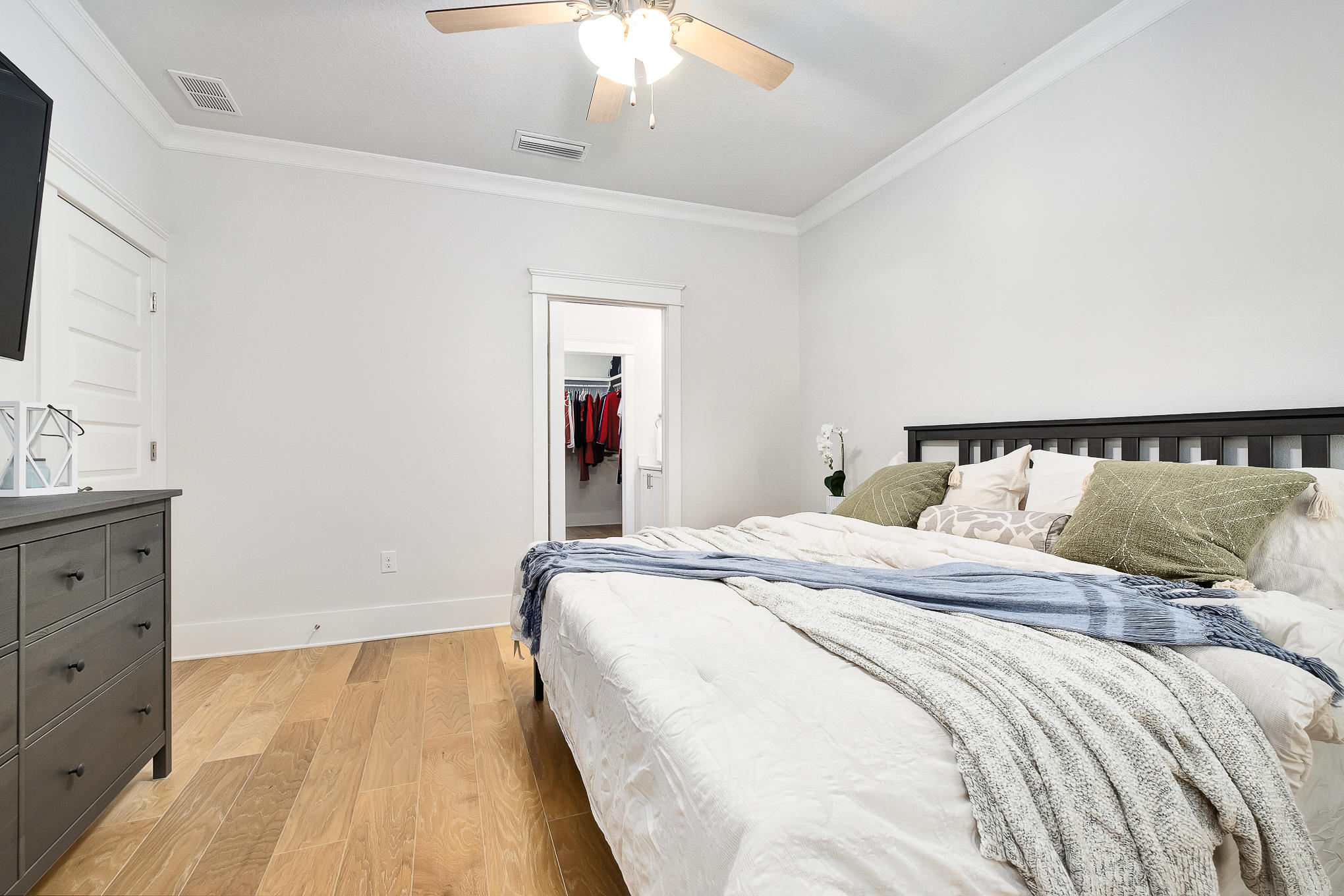 386 Grande Pointe Circle Inlet Beach, FL 32461 - Photo 15 of 50 a bedroom with a bed and a flat tv screen on dresser