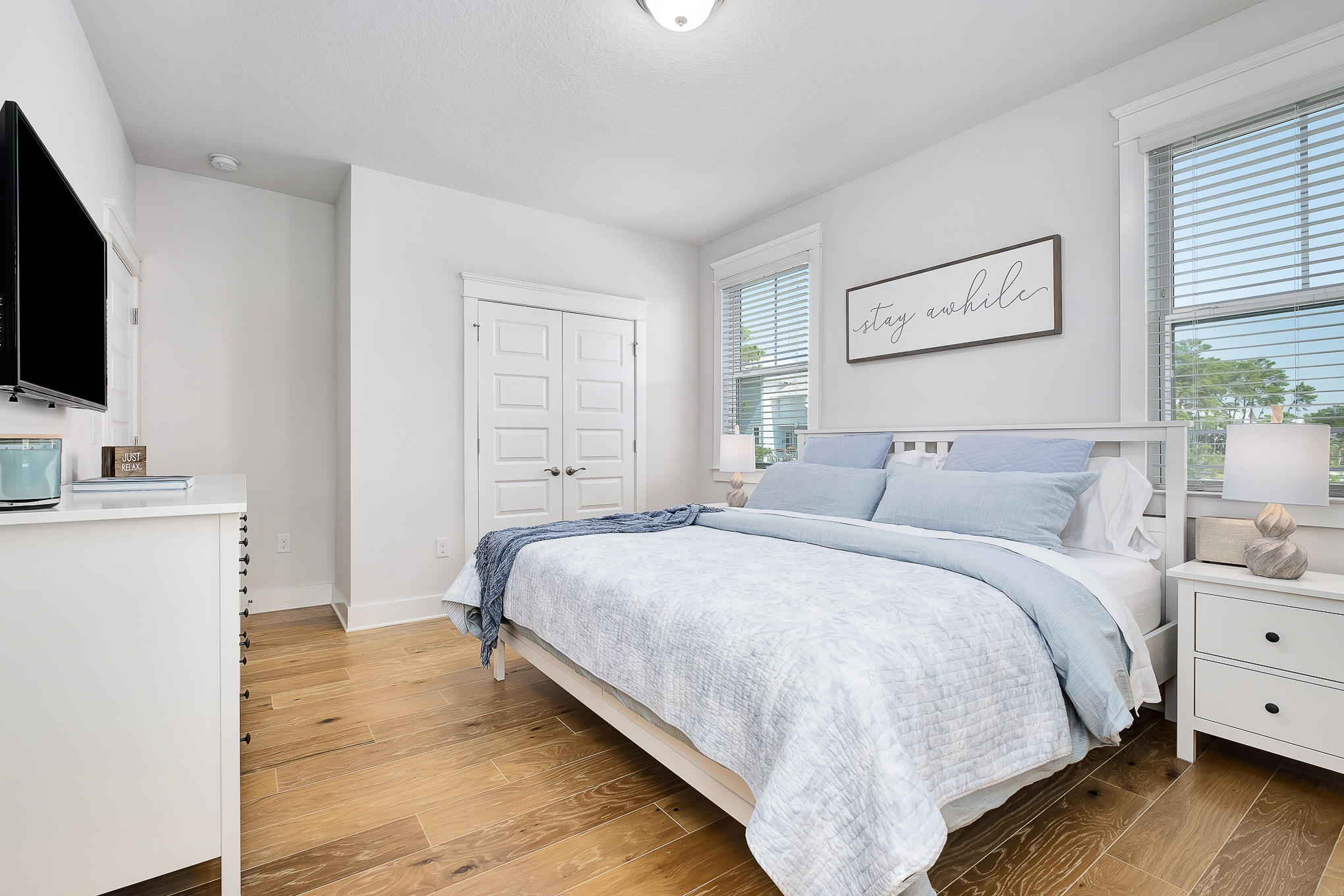 386 Grande Pointe Circle Inlet Beach, FL 32461 - Photo 29 of 50 a bedroom with a bed and a flat screen tv