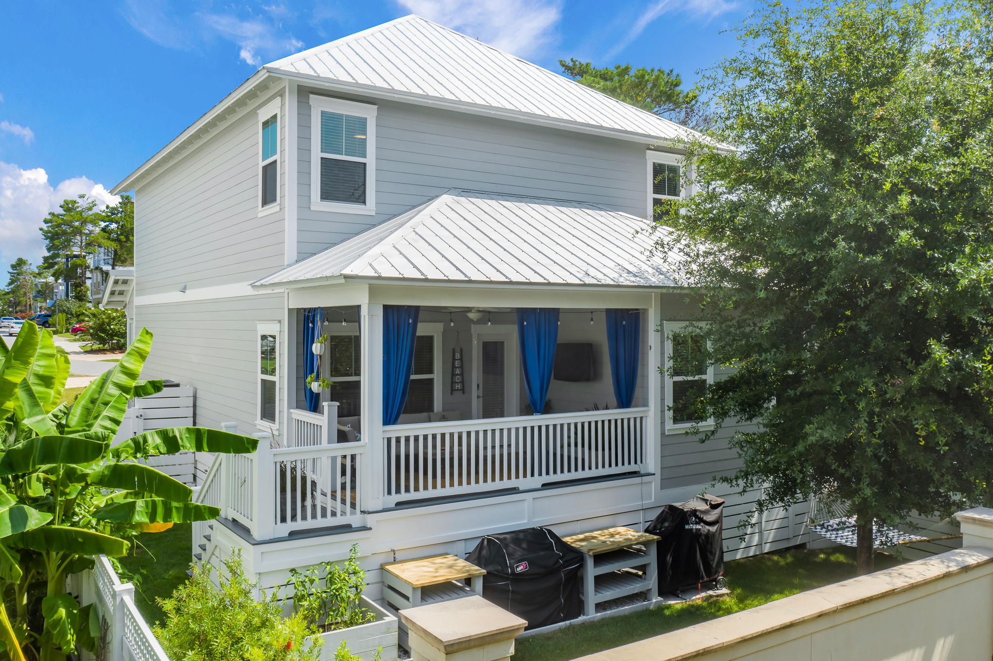 386 Grande Pointe Circle Inlet Beach, FL 32461 - Photo 41 of 50 a view of a house with a small yard and wooden fence