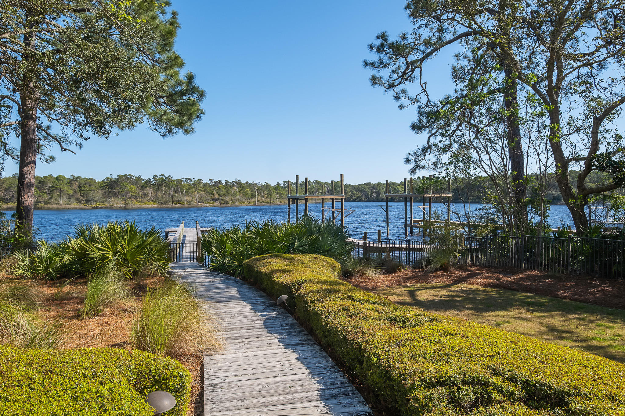 386 Grande Pointe Circle Inlet Beach, FL 32461 - Photo 48 of 50 a view of a lake with a building in the background