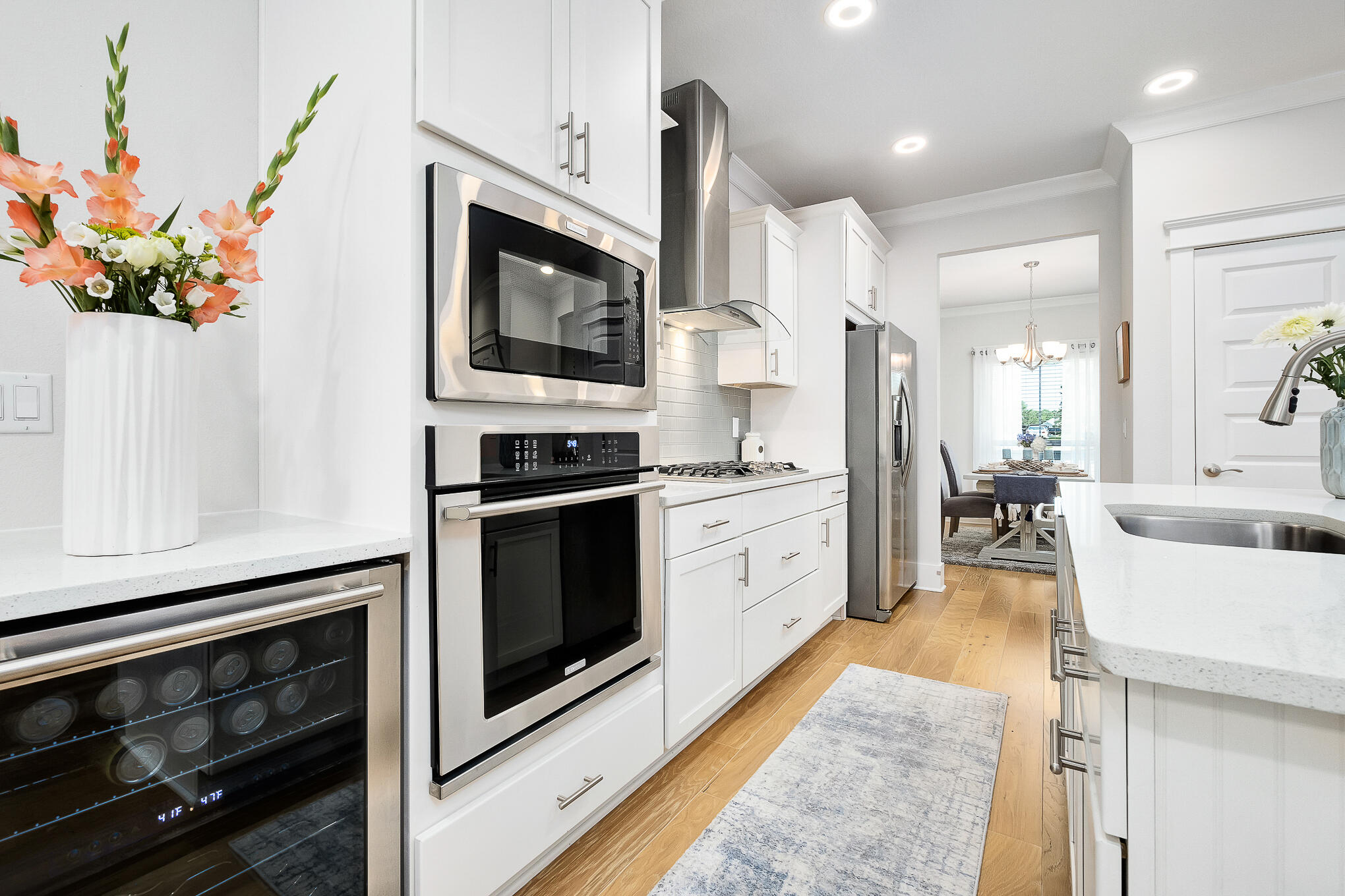386 Grande Pointe Circle Inlet Beach, FL 32461 - Photo 9 of 50 a kitchen with stainless steel appliances kitchen island granite countertop a stove a sink and a microwave
