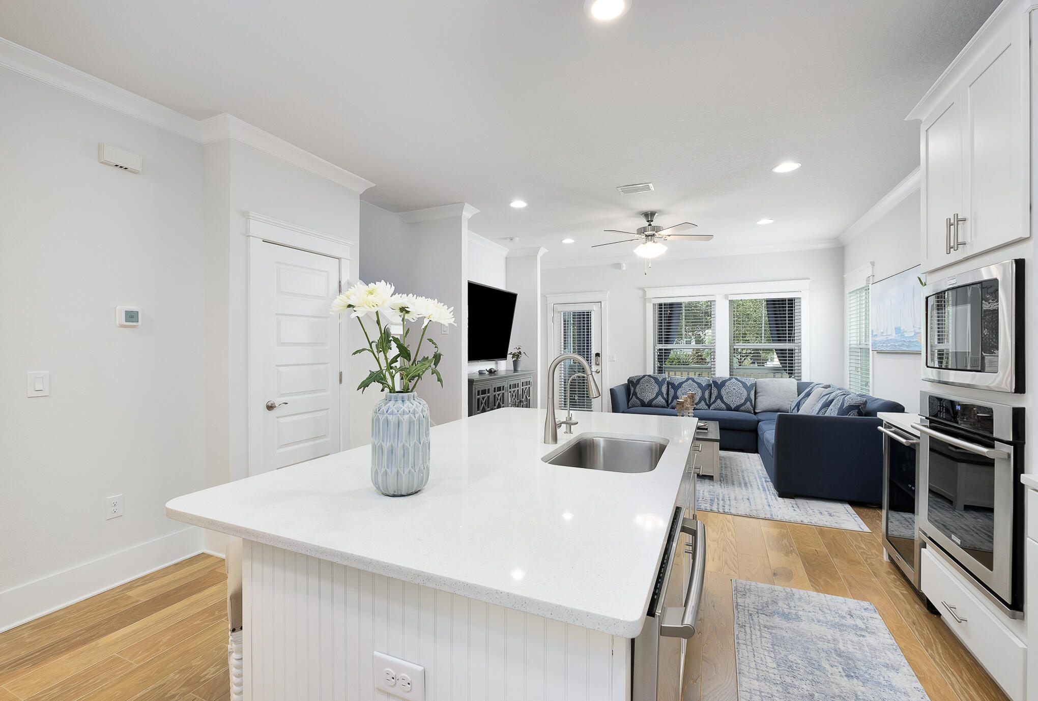 386 Grande Pointe Circle Inlet Beach, FL 32461 - Photo 10 of 50 a kitchen with stainless steel appliances kitchen island granite countertop a refrigerator a sink dishwasher a oven with a dining table and chairs