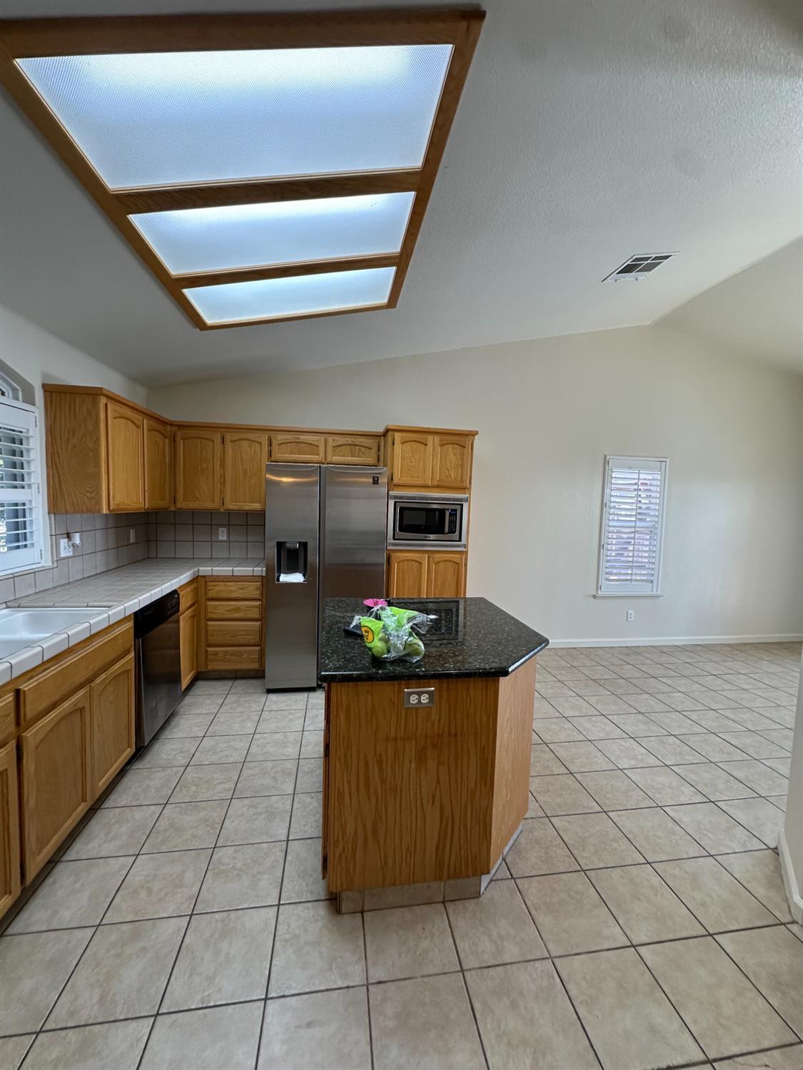 220 South Double Tree Way Madera, CA 93637 - Photo 21 of 69 a kitchen with stainless steel appliances granite countertop a sink and a cabinets
