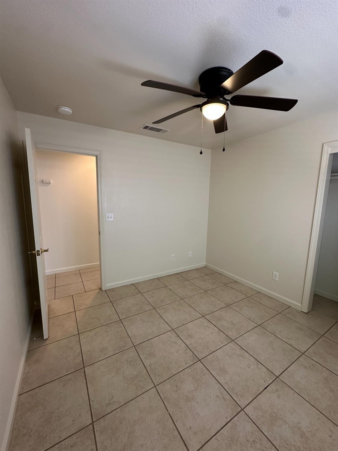 220 South Double Tree Way Madera, CA 93637 - Photo 36 of 69 a view of a livingroom with a ceiling fan and window