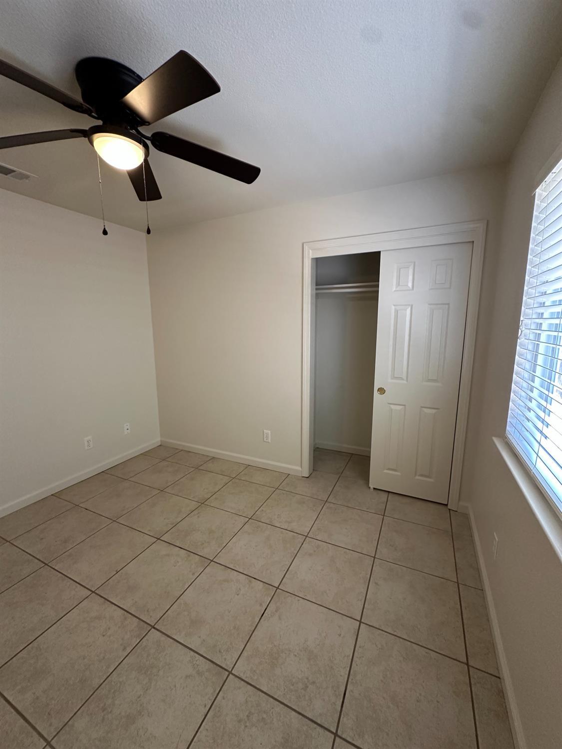 220 South Double Tree Way Madera, CA 93637 - Photo 37 of 69 a view of an empty room and window